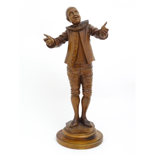 1321 - An early 20thC carved walnut figure modelled as a Pierrot, possibly the French mime artist and actor... 