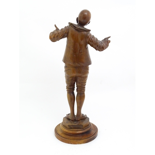 1321 - An early 20thC carved walnut figure modelled as a Pierrot, possibly the French mime artist and actor... 