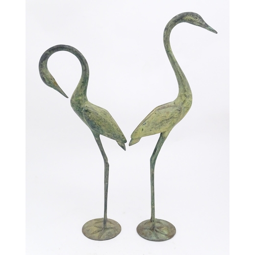 1327 - Two late 20thC cast models of crane / heron birds. Largest approx. 24