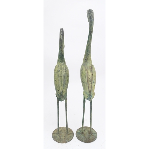 1327 - Two late 20thC cast models of crane / heron birds. Largest approx. 24