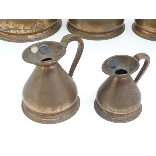 1328 - Five graduated copper haystack / harvest measures / jugs with loop handles with pewter seals / touch... 