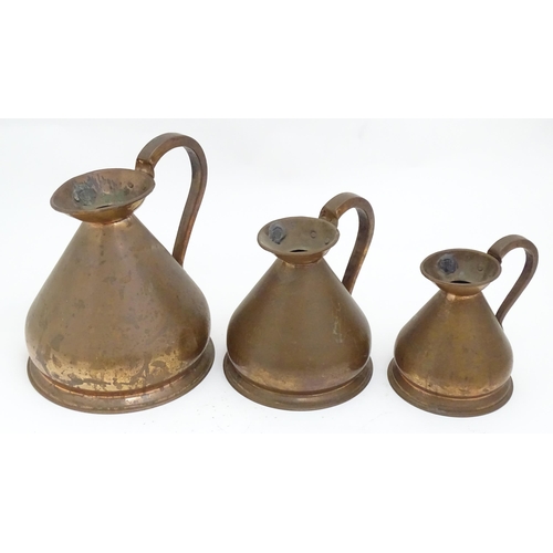 1328 - Five graduated copper haystack / harvest measures / jugs with loop handles with pewter seals / touch... 