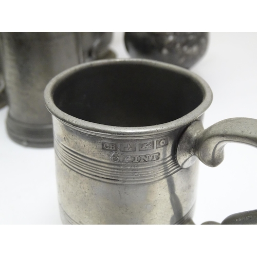 1331 - A quantity of 19thC and later pewter tankards, including examples by James Dixon & Sons, several wit... 