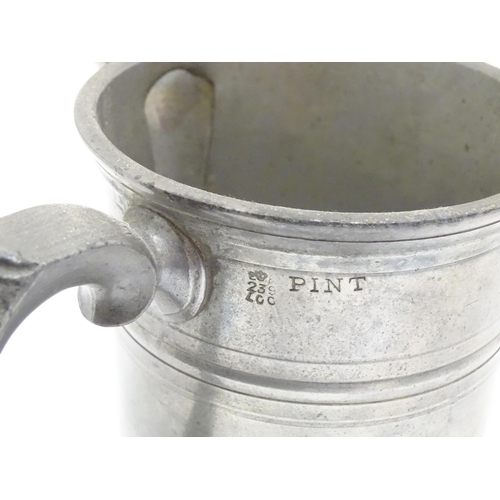 1331 - A quantity of 19thC and later pewter tankards, including examples by James Dixon & Sons, several wit... 