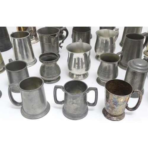 1331 - A quantity of 19thC and later pewter tankards, including examples by James Dixon & Sons, several wit... 