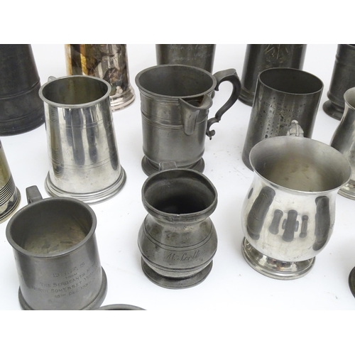 1331 - A quantity of 19thC and later pewter tankards, including examples by James Dixon & Sons, several wit... 