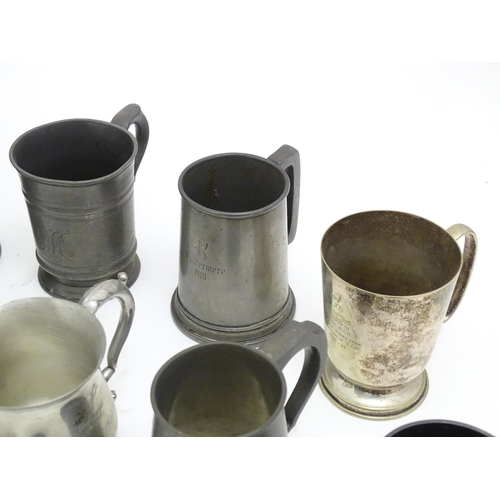 1331 - A quantity of 19thC and later pewter tankards, including examples by James Dixon & Sons, several wit... 