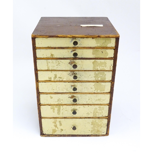 854 - Watchmakers / Repairers Equipment : A collector's cabinet with eight drawers containing assorted ite... 