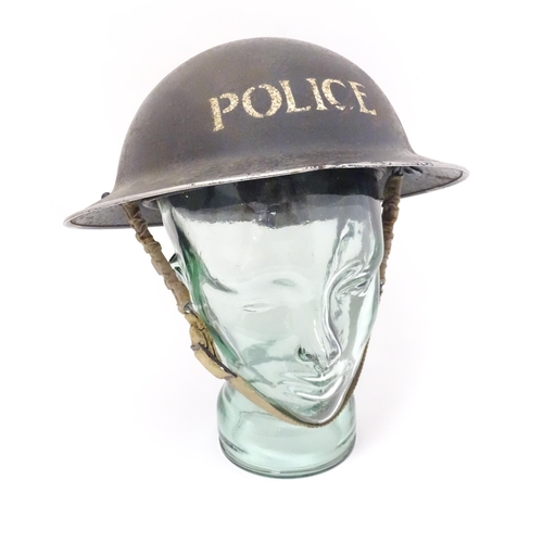 858 - Militaria , WWII / World War 2 / WW2 / Second World War : a steel brodie helmet in Police livery, wi... 