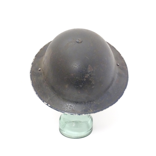 858 - Militaria , WWII / World War 2 / WW2 / Second World War : a steel brodie helmet in Police livery, wi... 