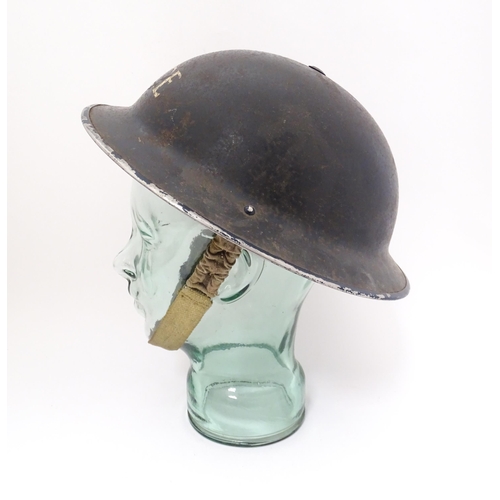 858 - Militaria , WWII / World War 2 / WW2 / Second World War : a steel brodie helmet in Police livery, wi... 