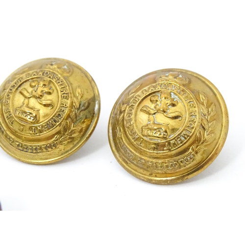 873 - Militaria: ten 20thC pressed brass tunic buttons, each with the regimental insignia of the South Lan... 