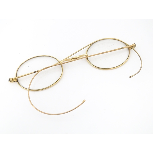 1280 - 19thC gilt metal spectacles / glasses, the bridge of one stamped Hadley. Approx. 4 1/2