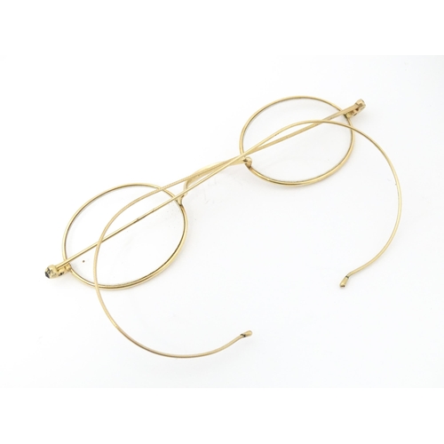 1280 - 19thC gilt metal spectacles / glasses, the bridge of one stamped Hadley. Approx. 4 1/2