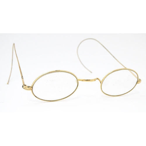 1280 - 19thC gilt metal spectacles / glasses, the bridge of one stamped Hadley. Approx. 4 1/2