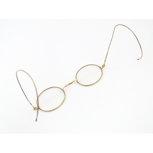 1280 - 19thC gilt metal spectacles / glasses, the bridge of one stamped Hadley. Approx. 4 1/2