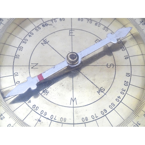 1284 - A 20thC brass cased surveyor's compass by Stanley & Co. of London, no. 1479. Approx. 4 1/2