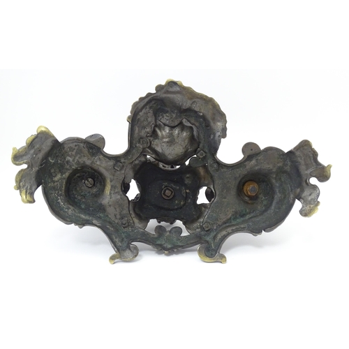 1295 - A cast desk standish in the Renaissance style with central merman flanked by two inkwells, and shell... 