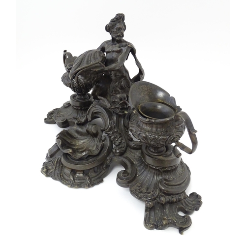 1295 - A cast desk standish in the Renaissance style with central merman flanked by two inkwells, and shell... 