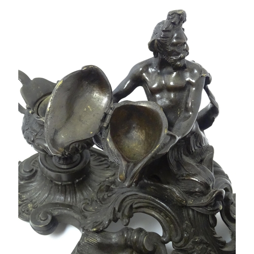 1295 - A cast desk standish in the Renaissance style with central merman flanked by two inkwells, and shell... 