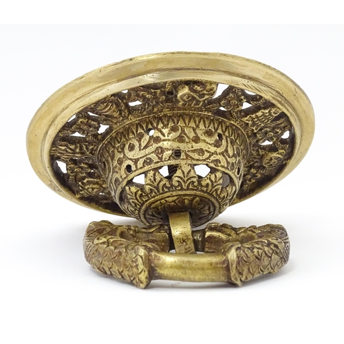 1302 - A 20thC cast gilt metal door knocker with floral and foliate detail. Approx. 5