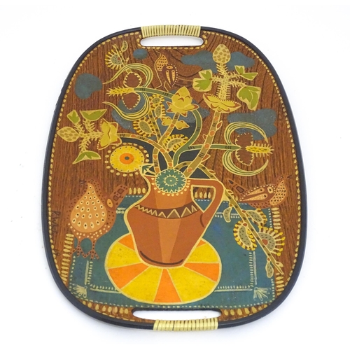 1339 - A mid century / vintage / retro tray of oval form with painted decoration depicting stylised still l... 