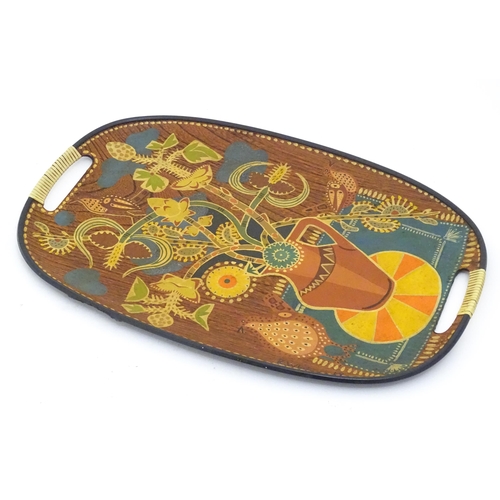 1339 - A mid century / vintage / retro tray of oval form with painted decoration depicting stylised still l... 