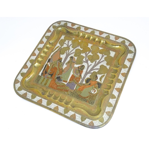 1340 - A Persian brass tray of squared form with engraved decoration depicting a garden landscape with a ki... 