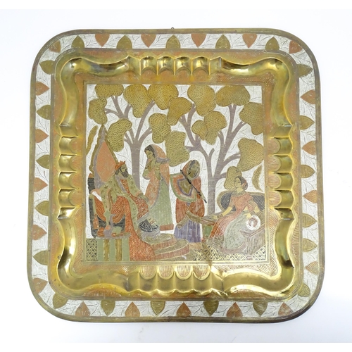 1340 - A Persian brass tray of squared form with engraved decoration depicting a garden landscape with a ki... 