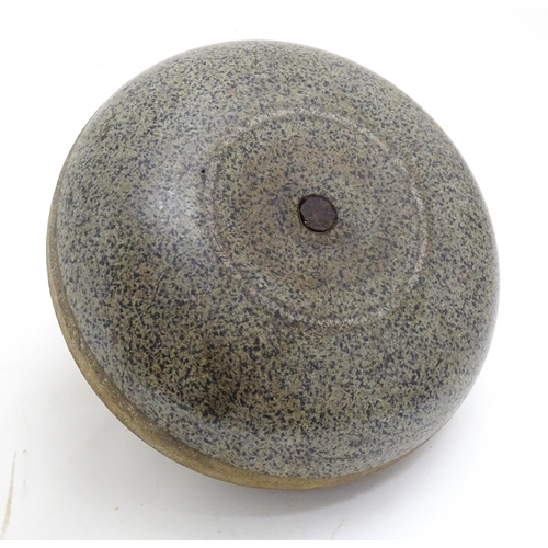 1343 - A Scottish granite curling stone with handle to centre stamped J Grant Leeds. Approx. 11