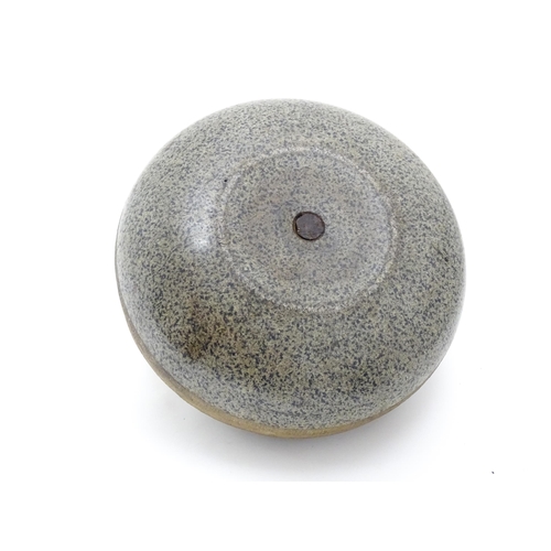 1343 - A Scottish granite curling stone with handle to centre stamped J Grant Leeds. Approx. 11