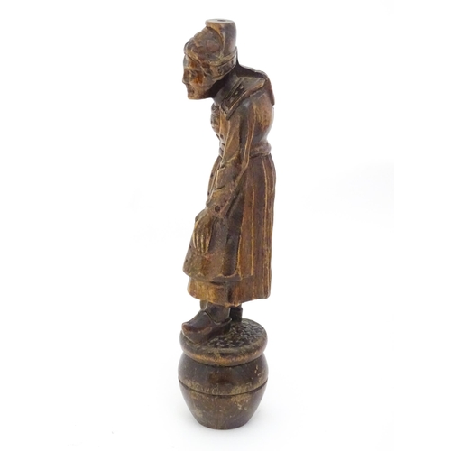 1349 - A Continental carved wooden figure of a Dutch lady in traditional costume and wearing clogs. The who... 