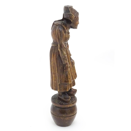 1349 - A Continental carved wooden figure of a Dutch lady in traditional costume and wearing clogs. The who... 