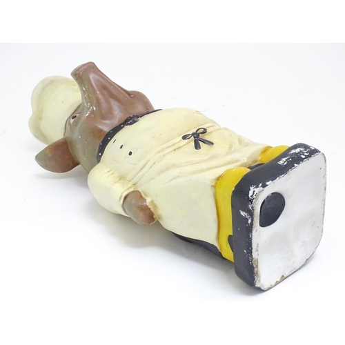 1351 - A novelty ceramic floor standing money box / charity collection box modelled as a pig dressed as a c... 