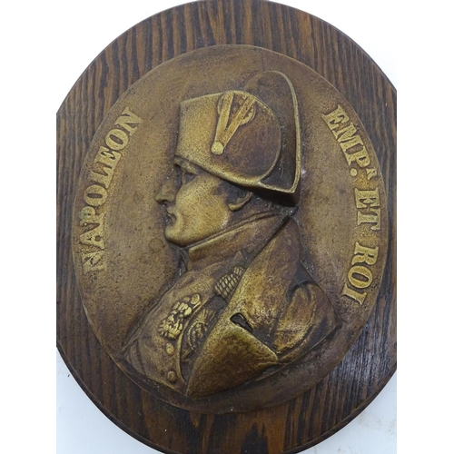 1355 - A cast plaque depicting Napoleon and titled 'Napoleon Empr et Roi' mounted on a wooden oval, togethe... 