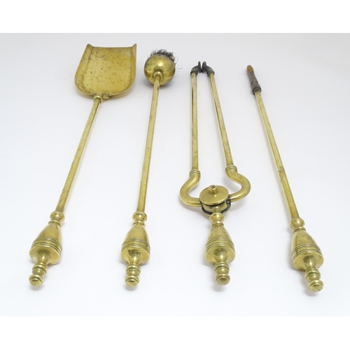 1368 - Victorian brass fire tools comprising tongs, poker, brush and shovel. The shovel approx 21