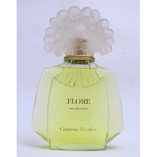 1370 - A large / oversized shop display advertising perfume bottle for Flore by Carolina Herrera. Approx. 1... 