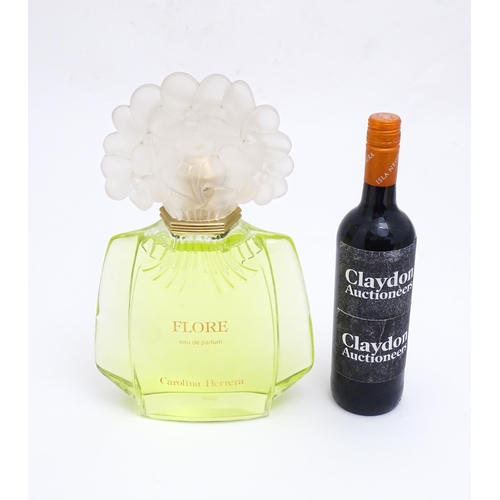 1370 - A large / oversized shop display advertising perfume bottle for Flore by Carolina Herrera. Approx. 1... 