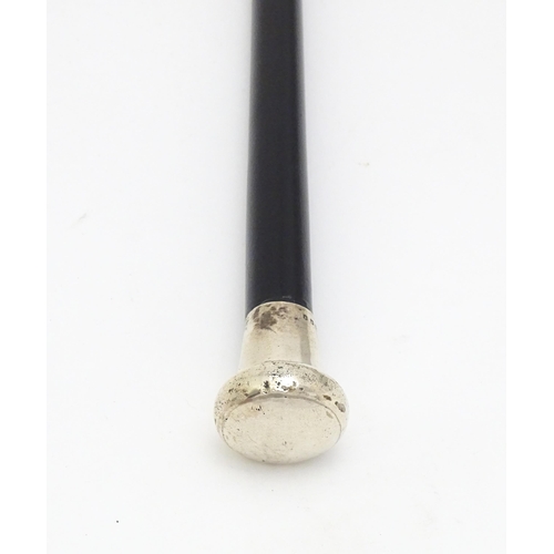 1409 - Stick / Cane : An ebonised walking cane with silver handle hallmarked London 1920. Approx. 35 1/2