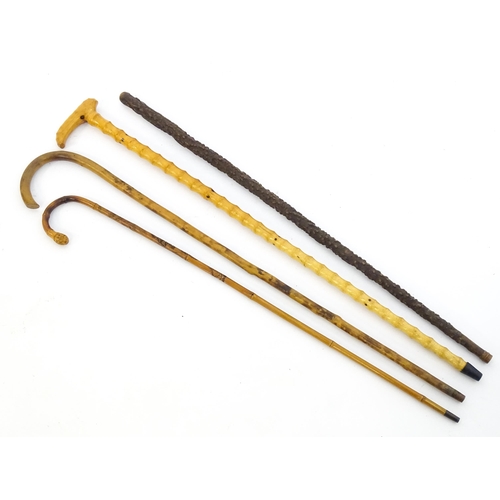 1411 - Sticks / Canes : Four assorted walking stick / canes to include an example with carved Oriental deco... 