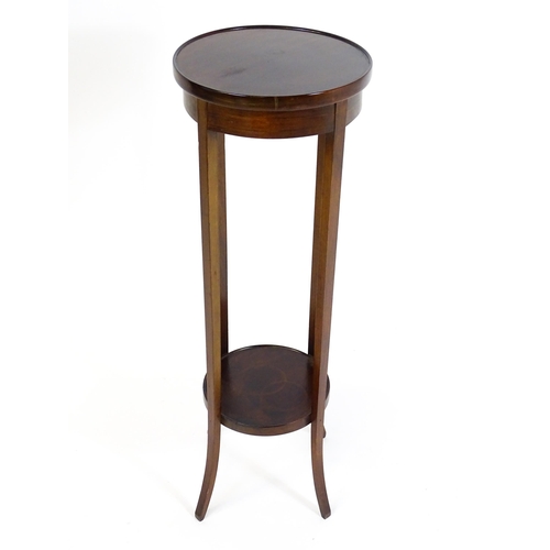 1750 - An early 20thC mahogany jardinière stand, with a circular top above four tapering, splayed supports ... 