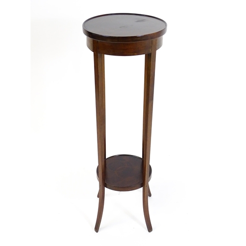 1750 - An early 20thC mahogany jardinière stand, with a circular top above four tapering, splayed supports ... 