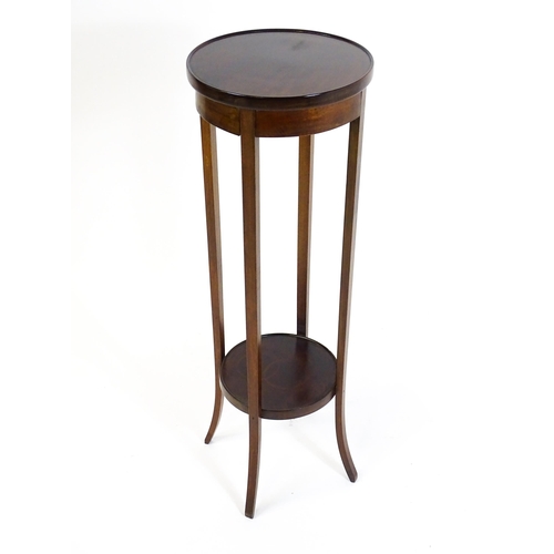 1750 - An early 20thC mahogany jardinière stand, with a circular top above four tapering, splayed supports ... 