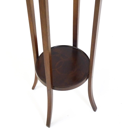 1750 - An early 20thC mahogany jardinière stand, with a circular top above four tapering, splayed supports ... 