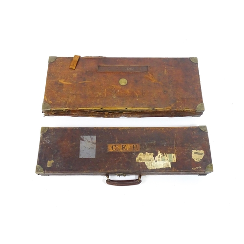 1172 - An oak, leather and brass reinforced double gun motor case by Henry Atkin, London, the interior with... 