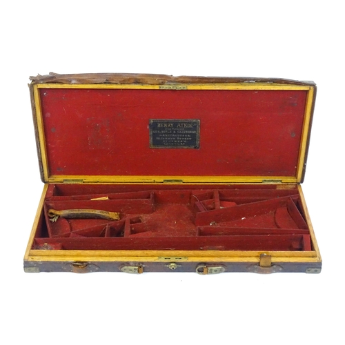 1172 - An oak, leather and brass reinforced double gun motor case by Henry Atkin, London, the interior with... 