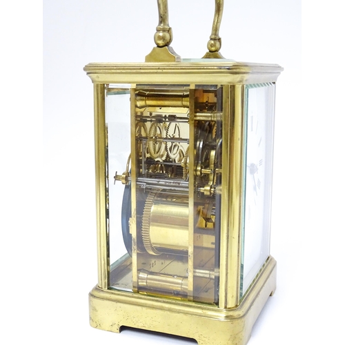 1536 - A late 19th / early 20thC French brass corniche cased carriage clock, by Richard & Cie. Having ename... 