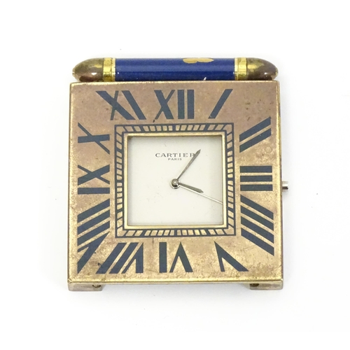 1539 - The front section, movement and dial of a Cartier folding travel clock with gilt brass and blue enam... 