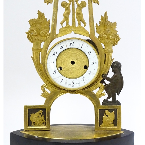 1541 - A 19thC empire style mantle clock with ormolu stylised lyre surround decorated with fruit and foliat... 