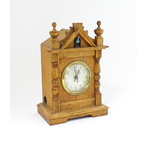 1547 - An oak mantel clock with cuckoo to top. Approx 9 1/2